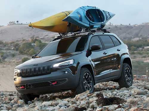 2023 Jeep Cherokee driving on a rocky path