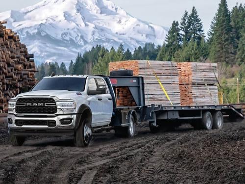 2023 RAM Chassis Cab towing a trailer of material