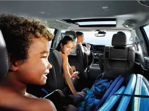 2023 Chrysler Pacifica PHEV interior view of family taking a trip