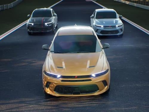 2023 Dodge Hornet times three driving on a road