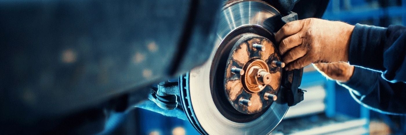 Close up view of brake rotor service being performed